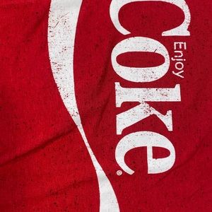 Red “enjoy coke” t-shirt by Coca Cola.